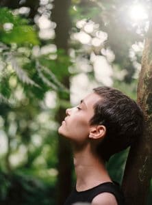 Mindfulness for Adults With ADHD 2 a girl leaning on a tree