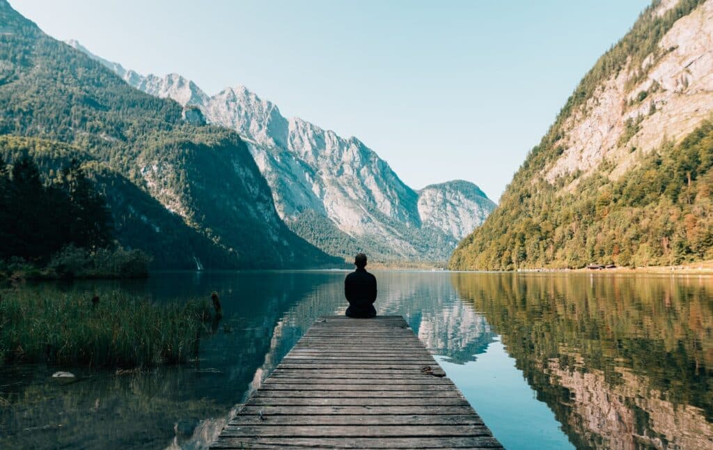 Mindfulness for Adults With ADHD 1 a person sitting beside a lake